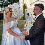 Rochie de mireasă tip prințesă din tafta mikado cu aplicații argintii din dantelă cusute manual și voal lung tip capelă efectuată la comandă de Lulytas Dresses